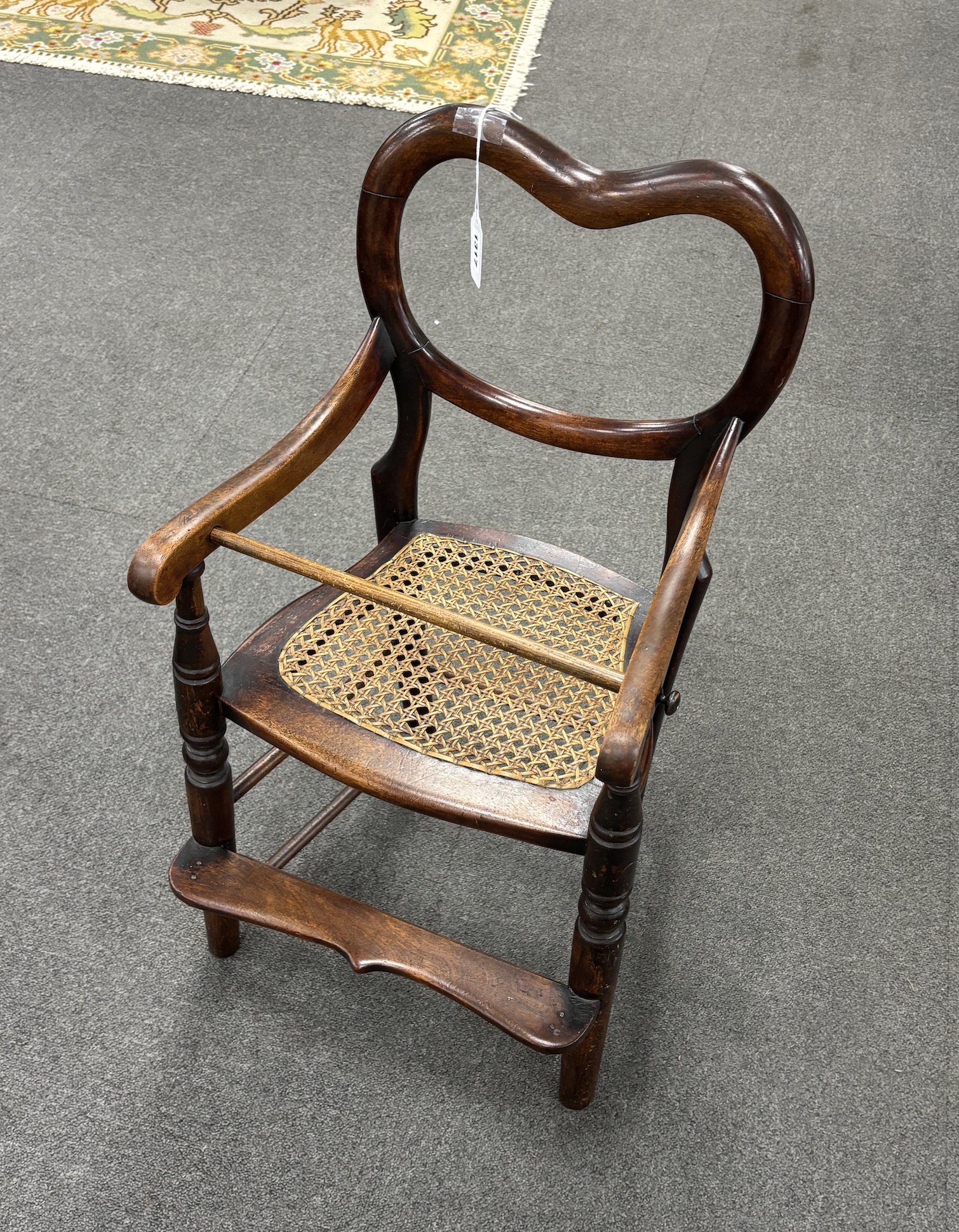 A Victorian mahogany child's chair with caned seat, width 71cm